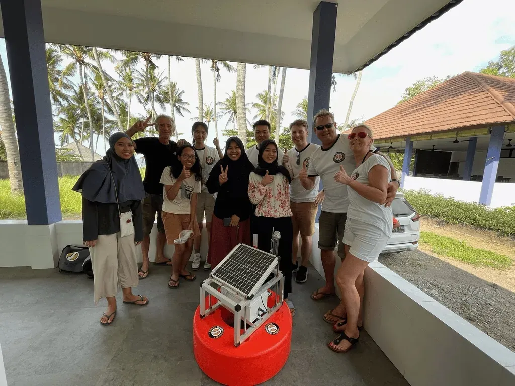 A Save Nemo field team gathered around a Nemo Pi buoy